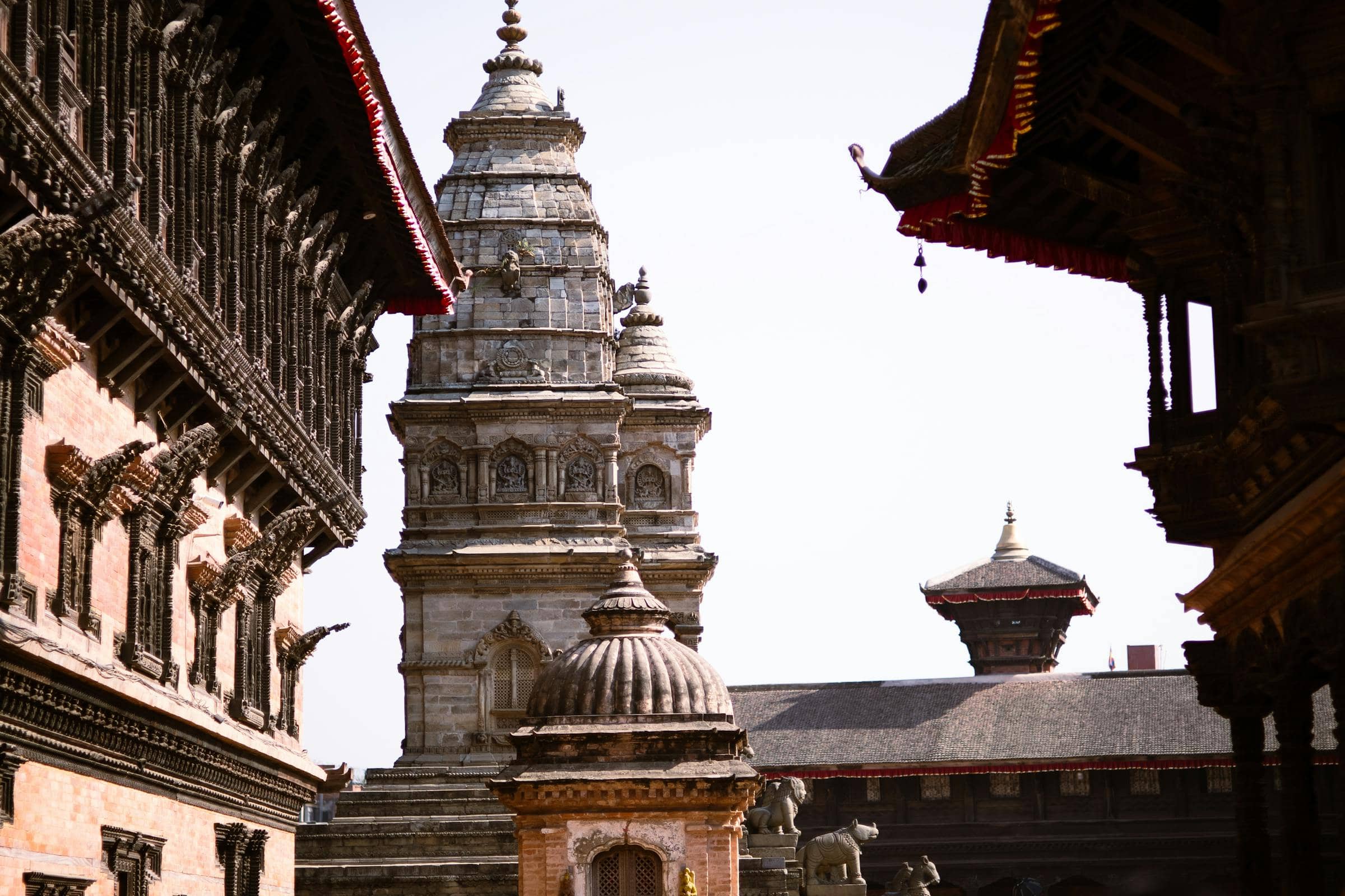 Bhaktapur Durbar — carved Newari shikhara temples in late afternoon light.